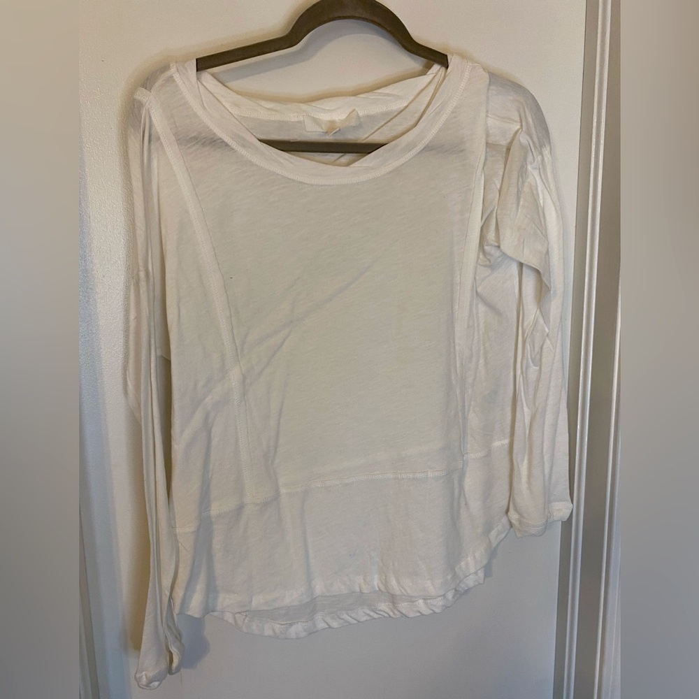 White, long sleeve shirt.